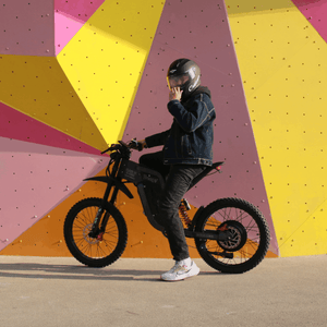 Freego electric dirt bike with rider wearing matching helmet