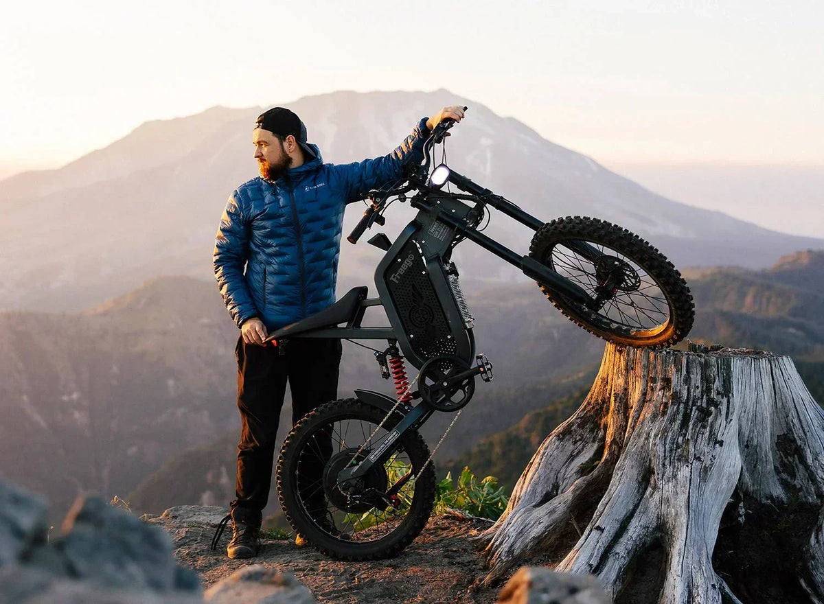 a man with a Freego X2 Dirt Master in the mountains