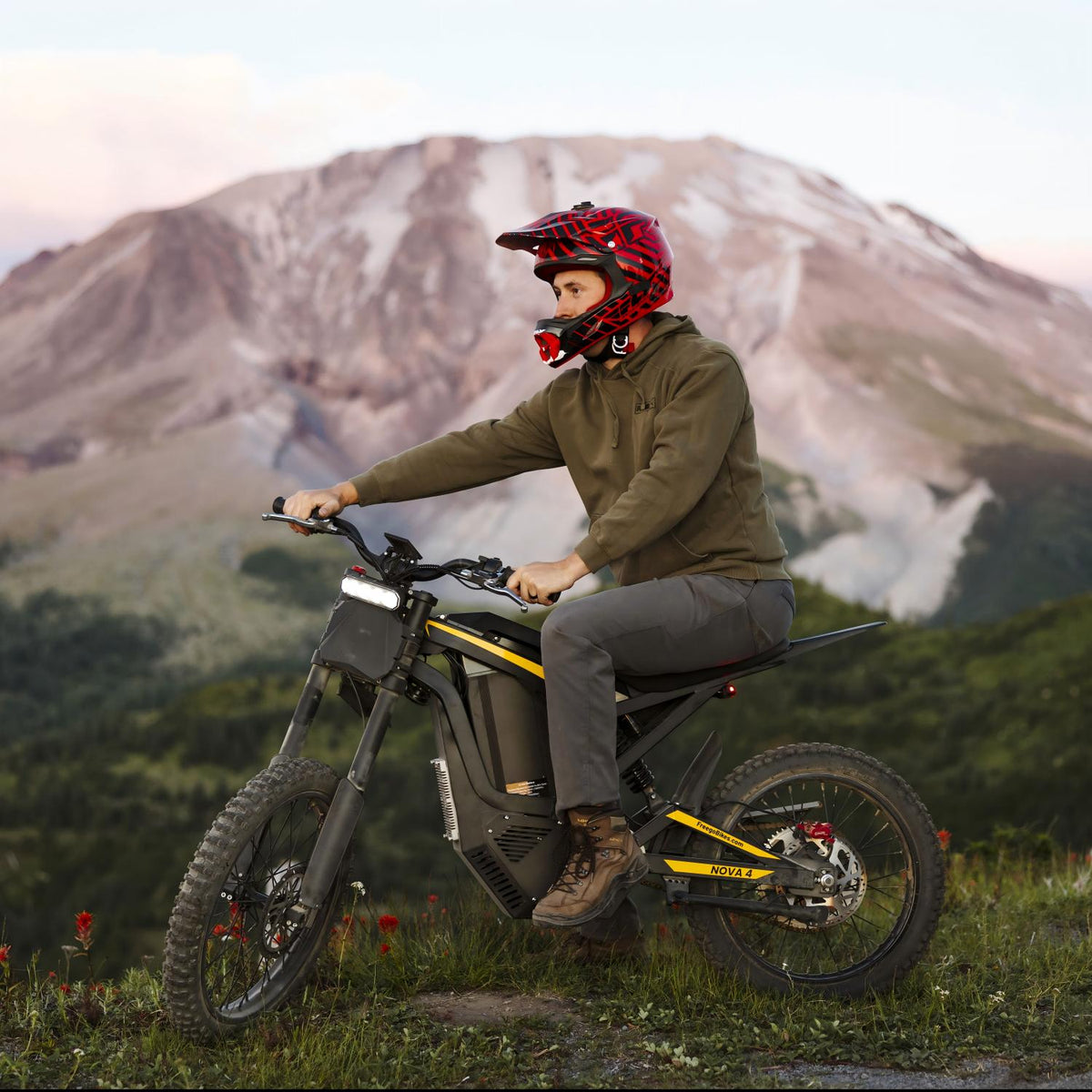 Rider wearing a helmet on a Freego Nova 4 riding on a mountain trail, showcasing powerful off-road performance and adventure capability.