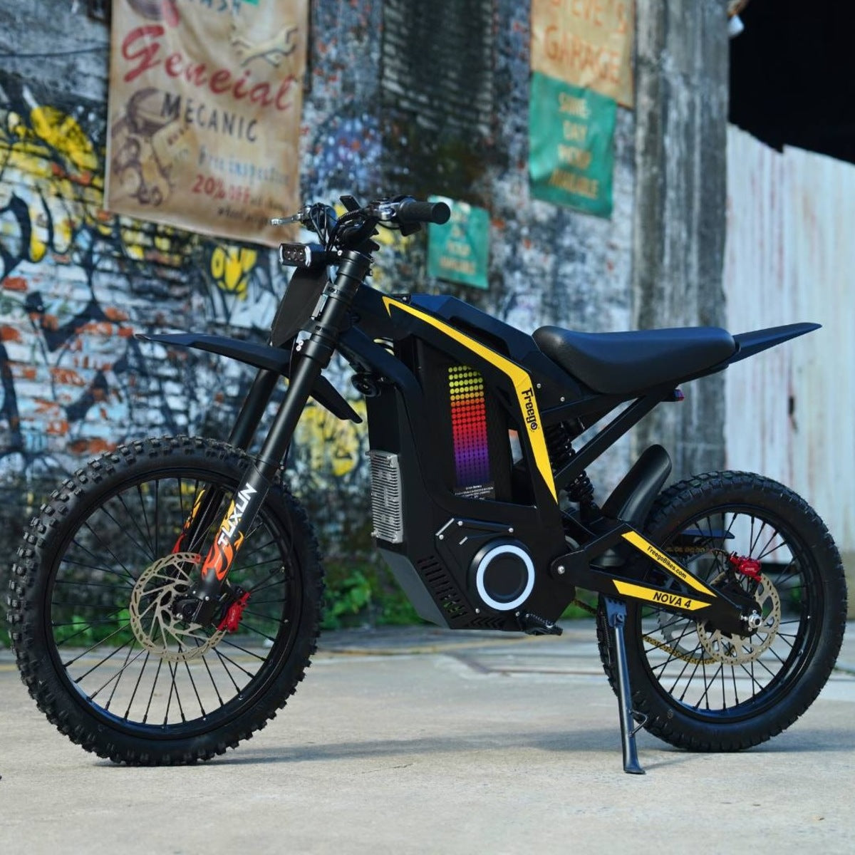 Freego Nova4 electric dirt bike parked on concrete with graffiti wall background