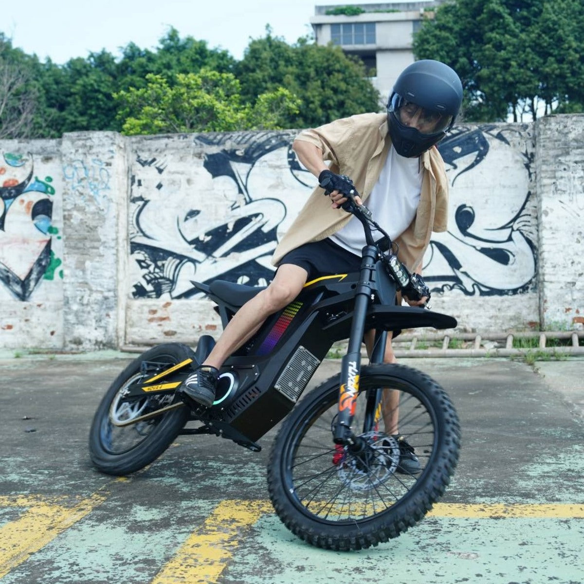 Rider performing drift on Freego Nova4 electric dirt bike in urban graffiti area